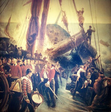 The men being mustered to attention whilst the women and children abandon ship first